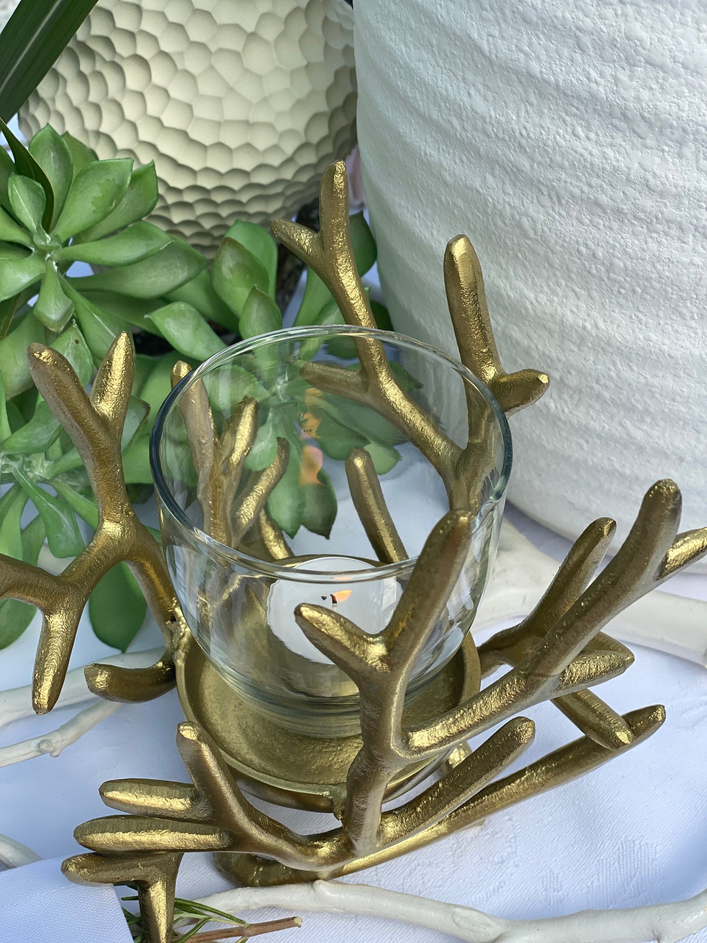 Ljuslykta korall i guld